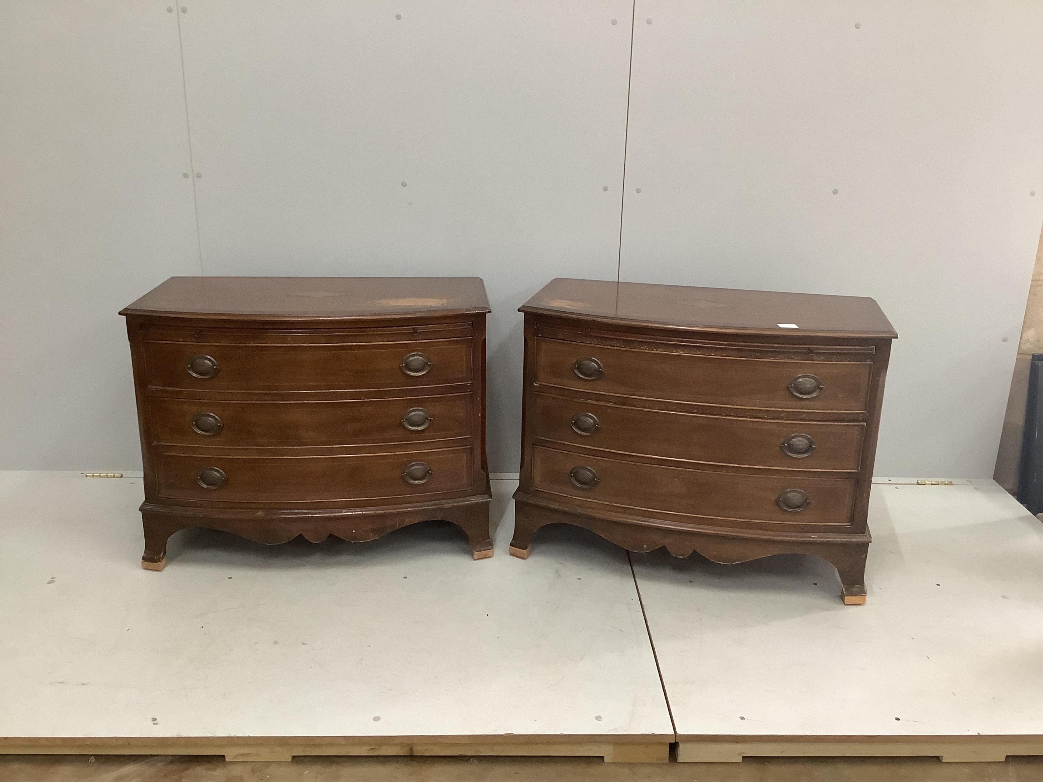 A pair of reproduction inlaid mahogany bow front chests of three long drawers, width 87cm, depth 49cm, height 68cm. Condition - poor to fair